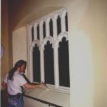 The completed window restoration receives a new coat of paint.