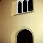 The completed window restoration receives a new coat of paint.